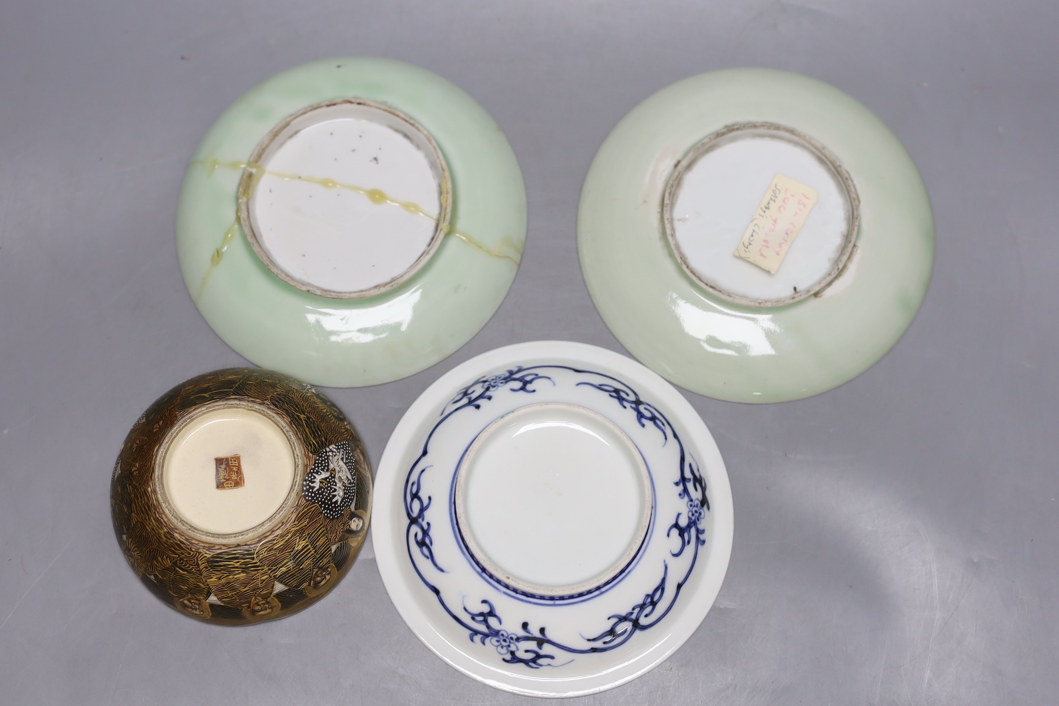A pair of Japanese Nabesima style jars and covers and a similar footed dish, together with a Japanese Satsuma bowl, 11cm diameter and two plates (5)